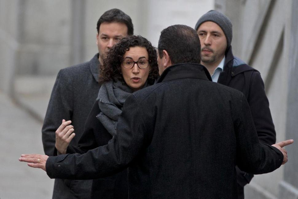 Catalan separatists face charges as key figure flees abroad