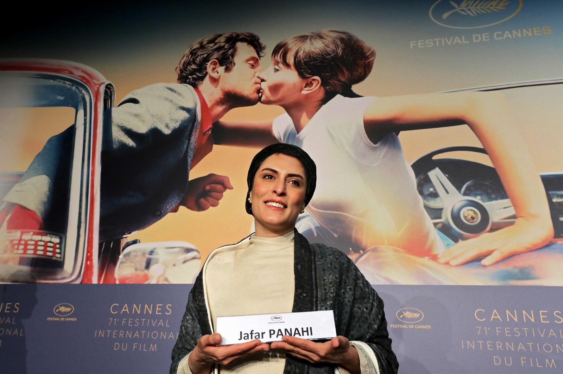 Barred Iranian director gets standing Cannes ovation