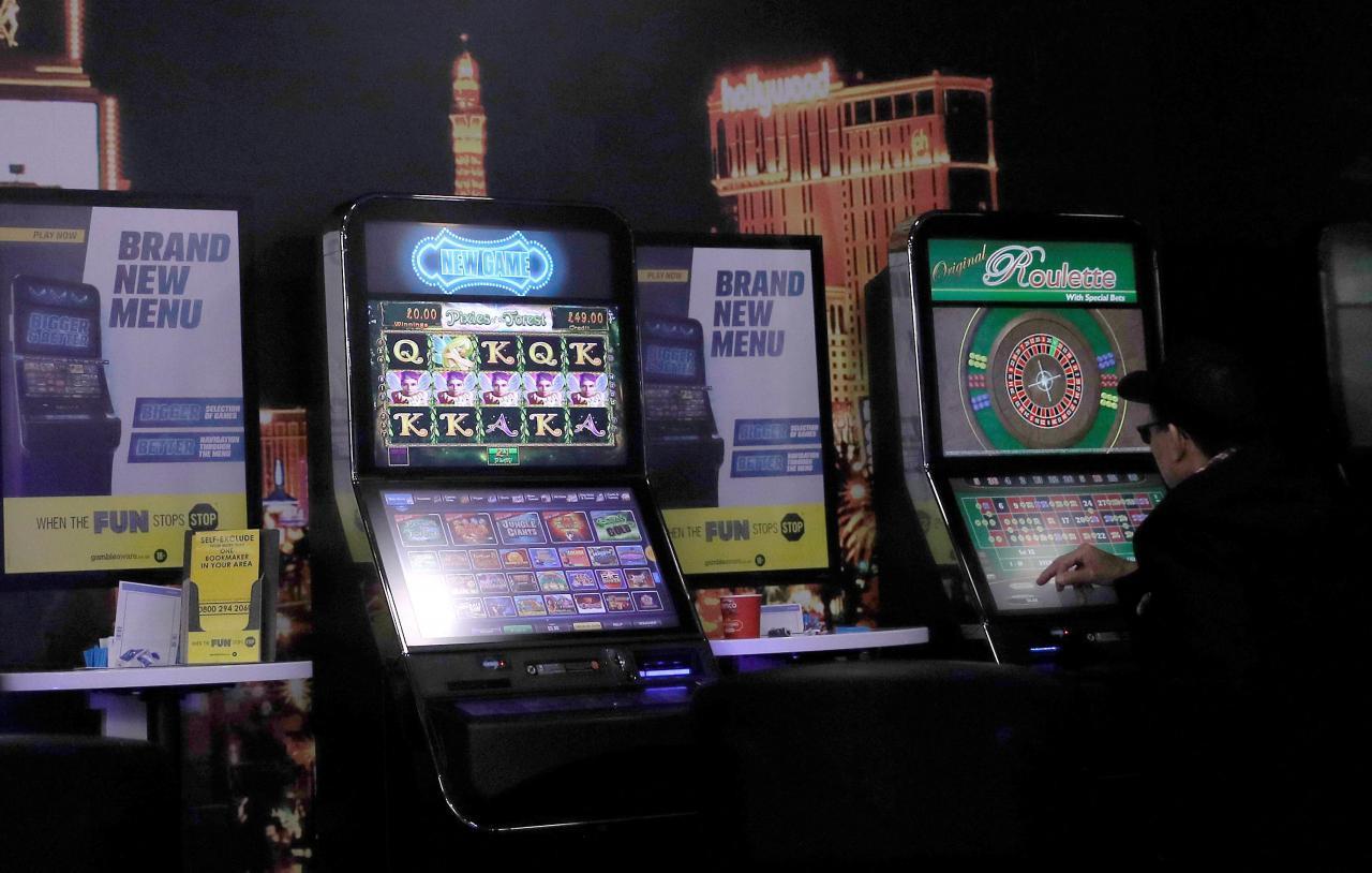 Britain cuts top stake on gambling machines on addiction fears