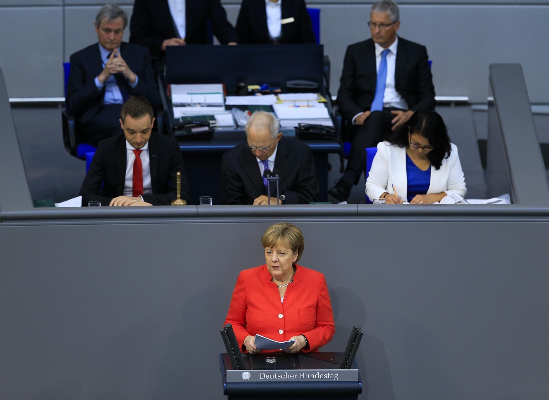 Merkel warns Trump against trade war