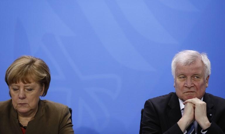 German interior minister says dispute with Merkel is history