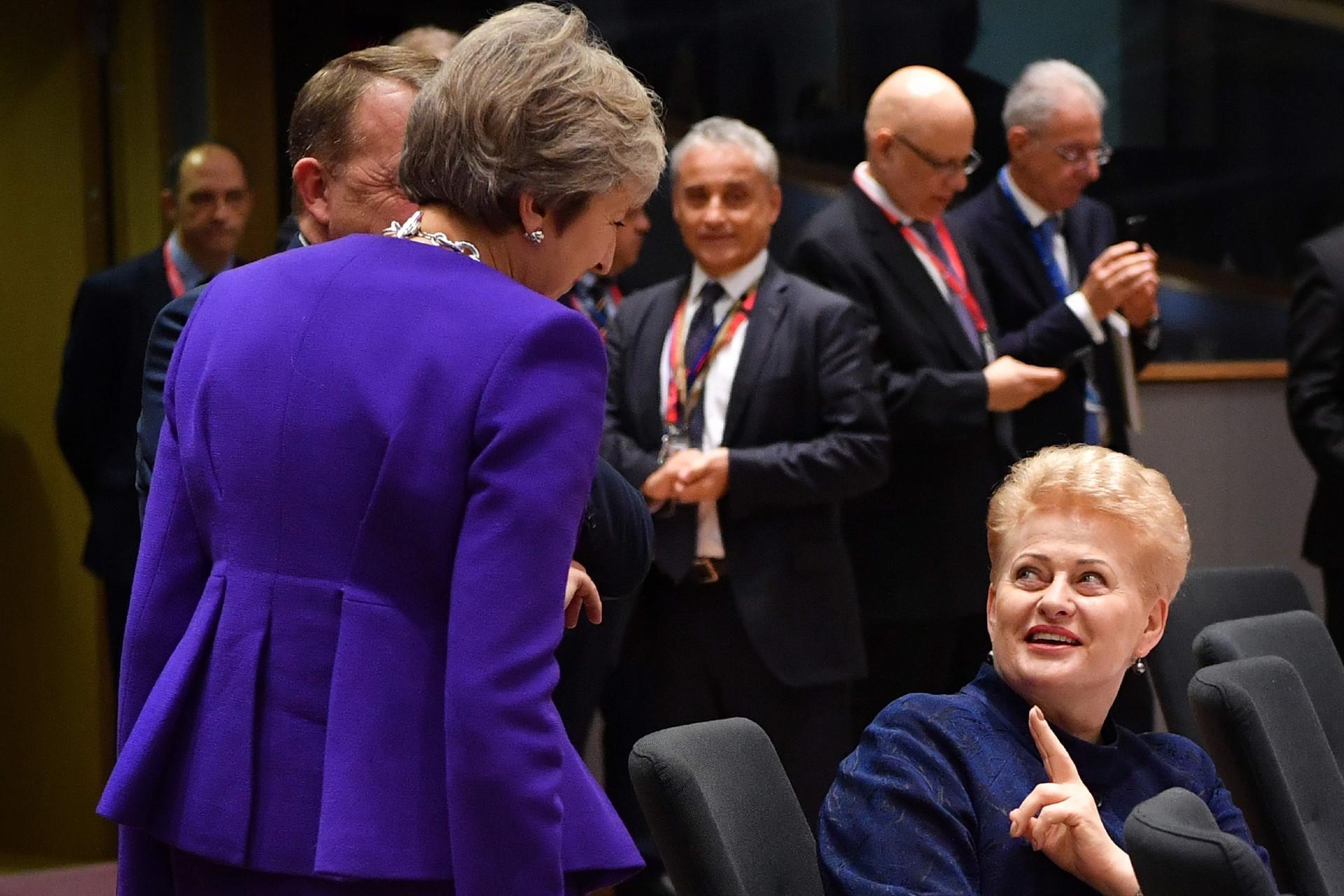 UK PM mulls longer transition as EU demands Brexit progress