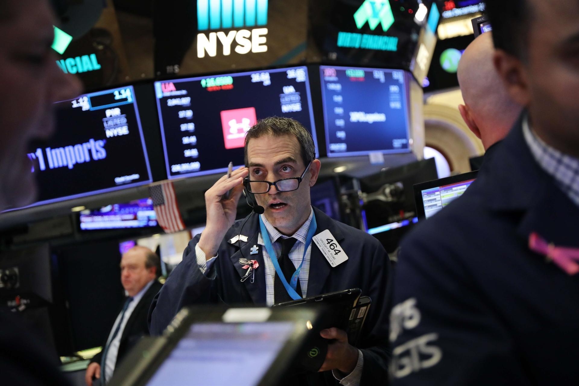 Fed lifts rates for 4th time this year but sees fewer hikes