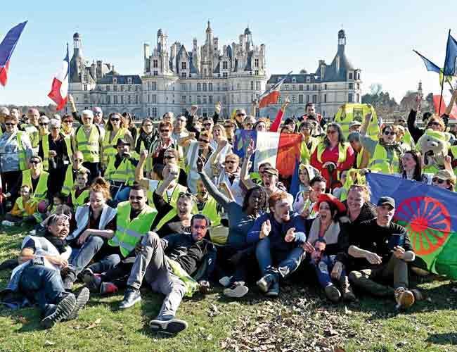 Thousands march as France’s ‘yellow vest’ protests rumble on