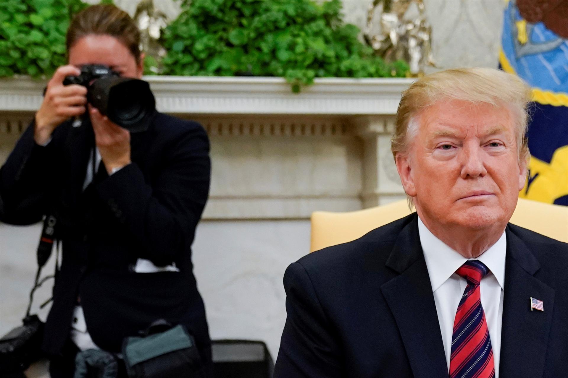 Trump ratchets up pressure on China, threatens tariff hikes