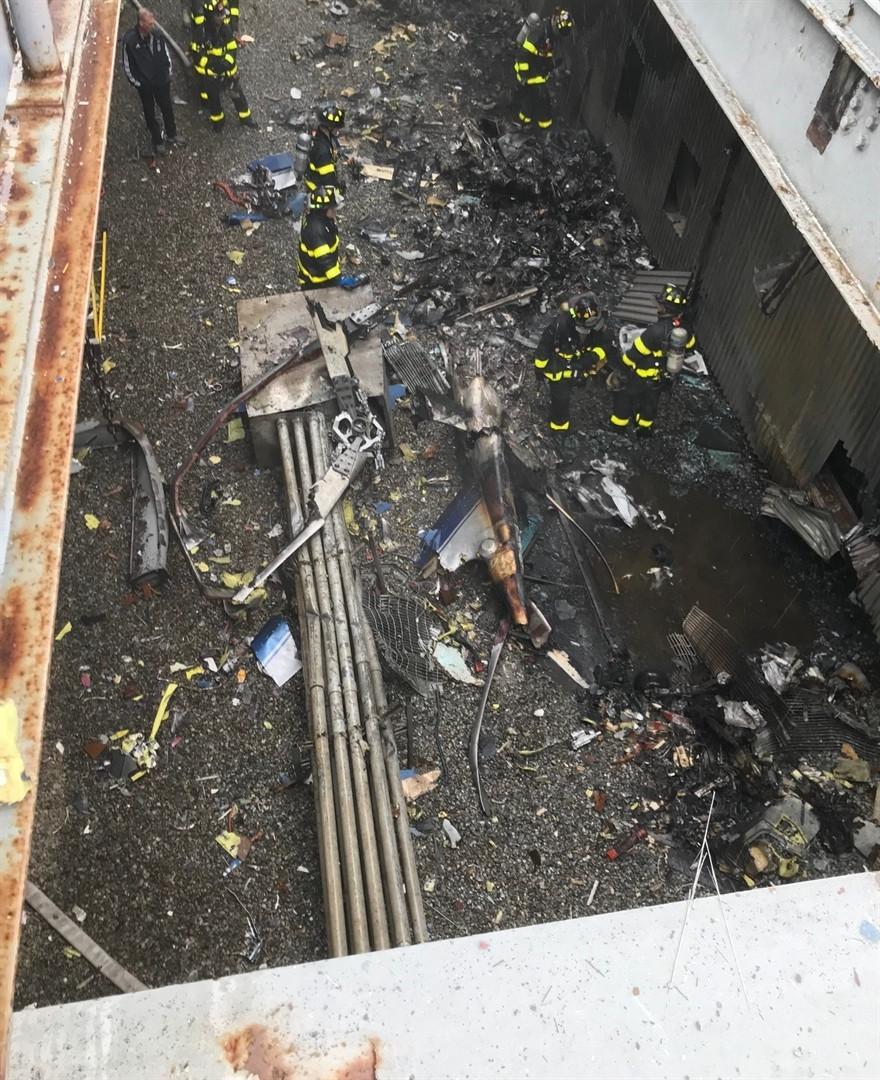 One dead as helicopter crash-lands on Manhattan building
