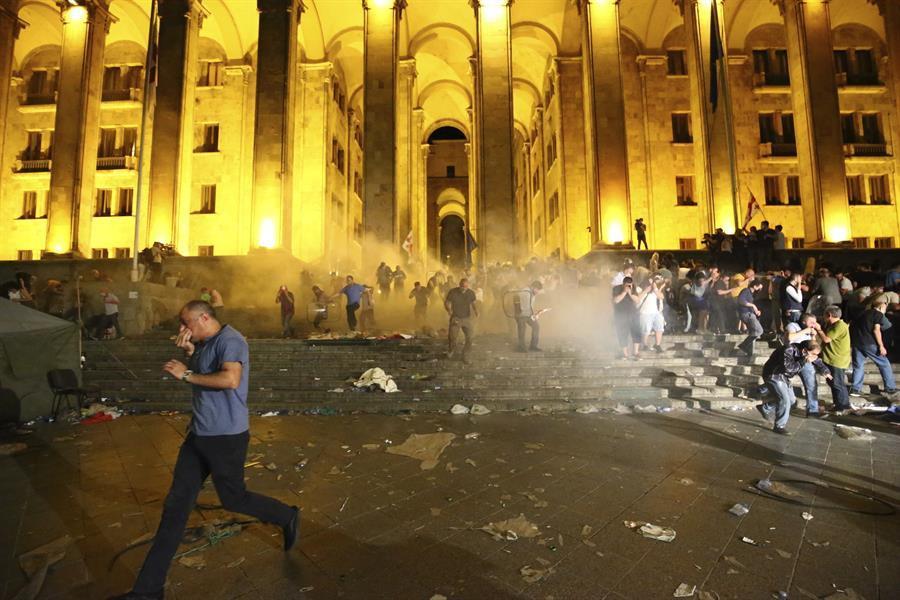 Georgians angry over Russian lawmakers visit try to storm parliament