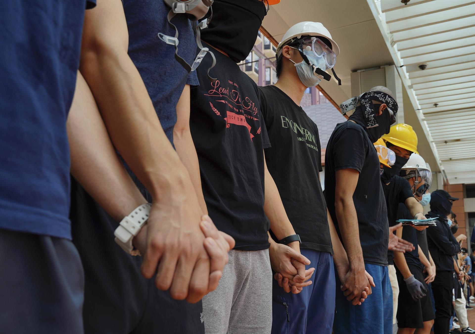 Hong Kong tells US to stay out; students form protest chains