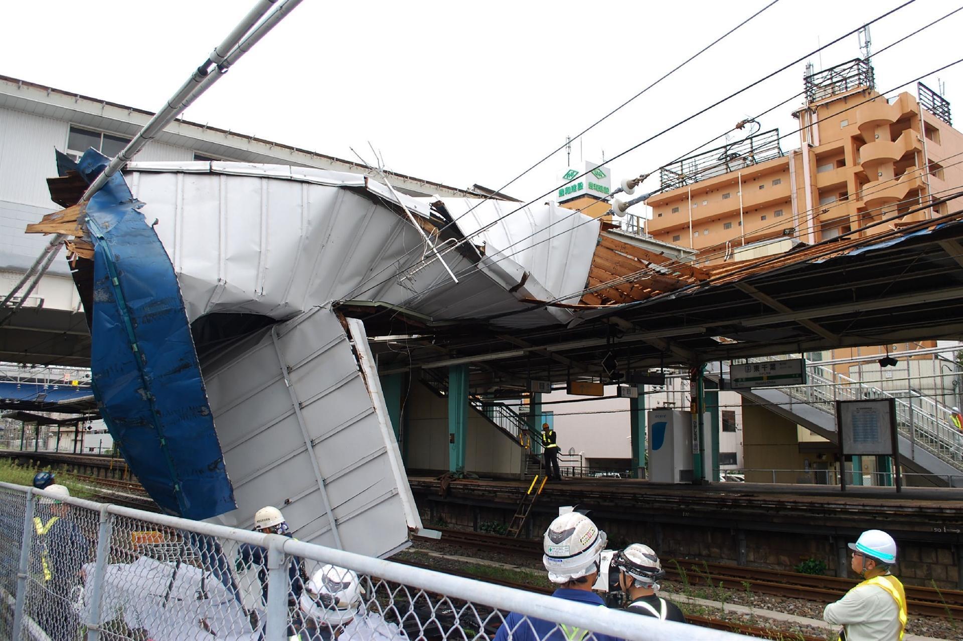Woman killed as strong typhoon lashes Tokyo area, cutting power and transport