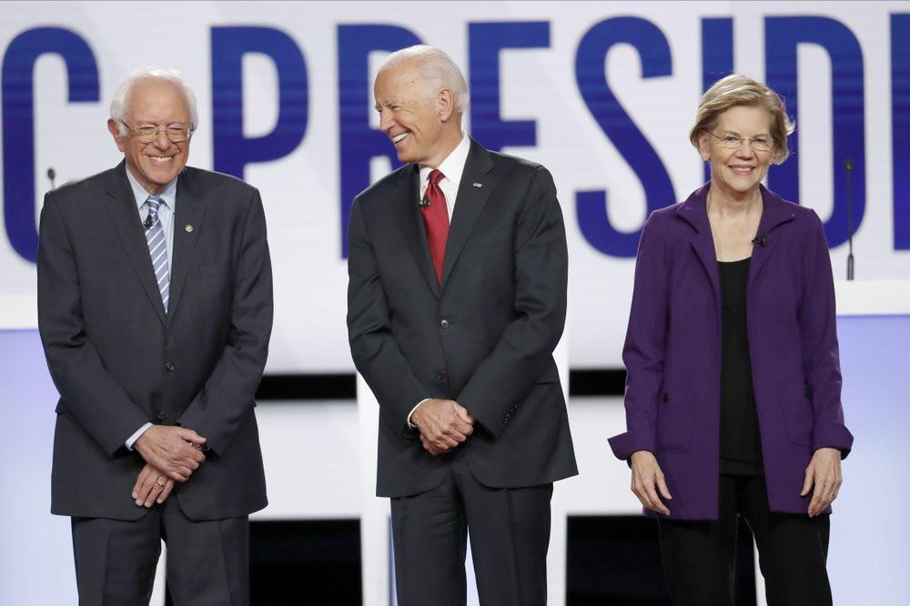 Debate rivals assail Warren as she joins Democrats’ top rank