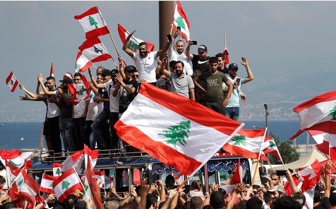Lebanon set to cut ministers pay as protests engulf country