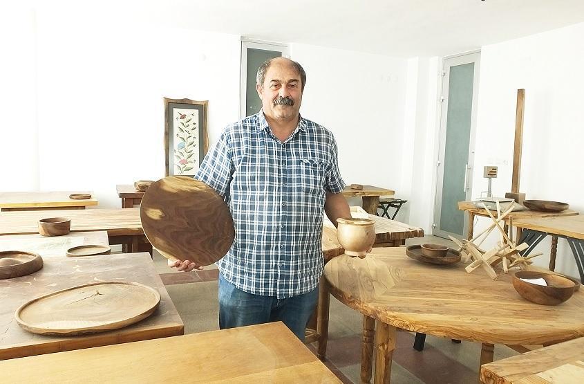 Engineer crafts wasted olive tree branches