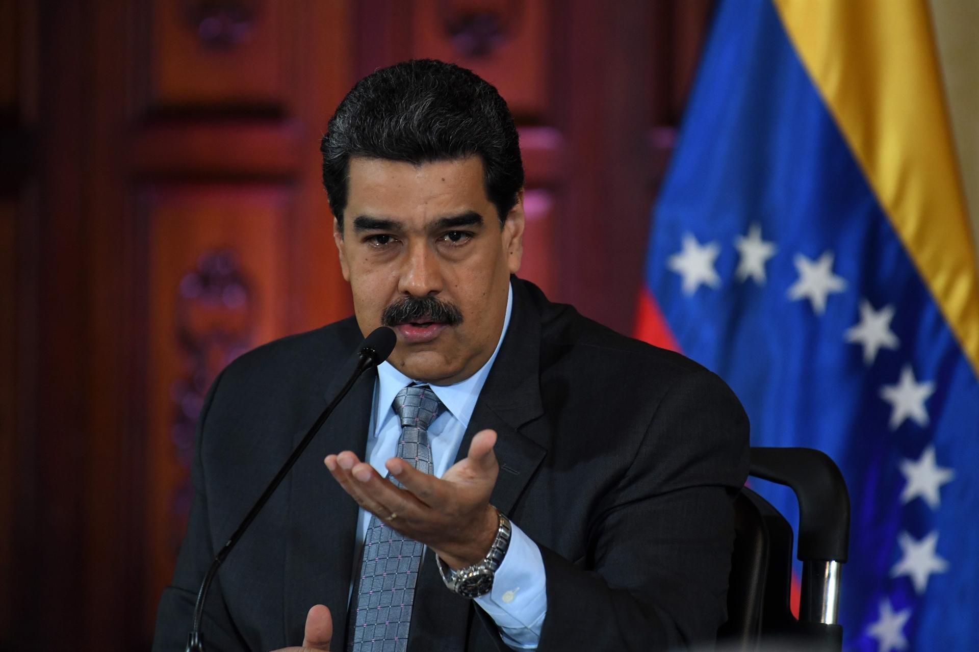 US issues some exemptions to Venezuela sanctions, targets more officials