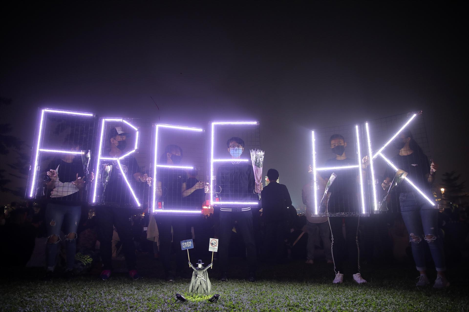 Hong Kong pro-democracy lawmakers detained, student mourned