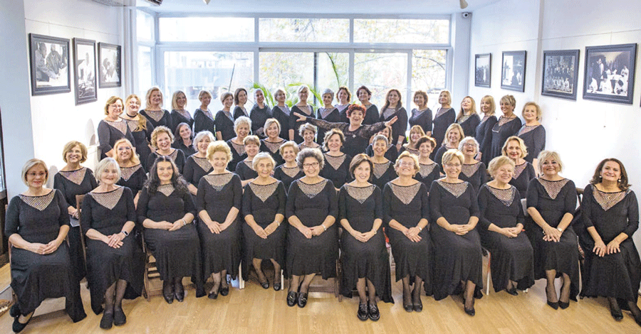 Choir members performing for 20 years together