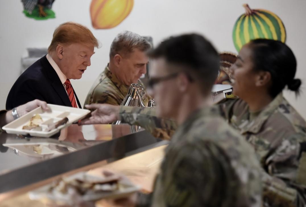 Trump hints new Taliban peace deal in Afghanistan visit