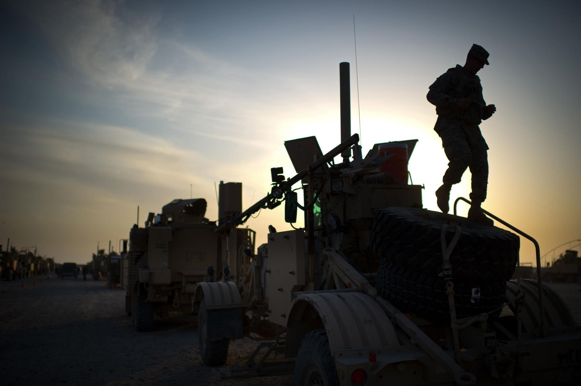 Iraq wants foreign troops out after air strike, Trump threatens sanctions