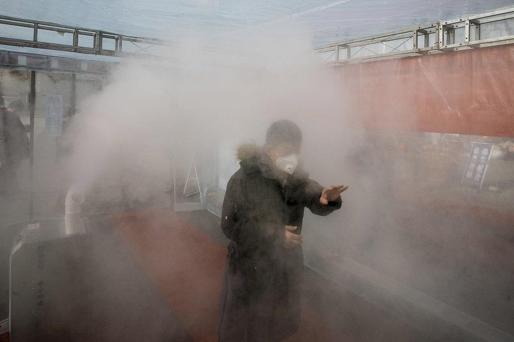 China’s new virus cases fall again, deaths now exceed 1,100