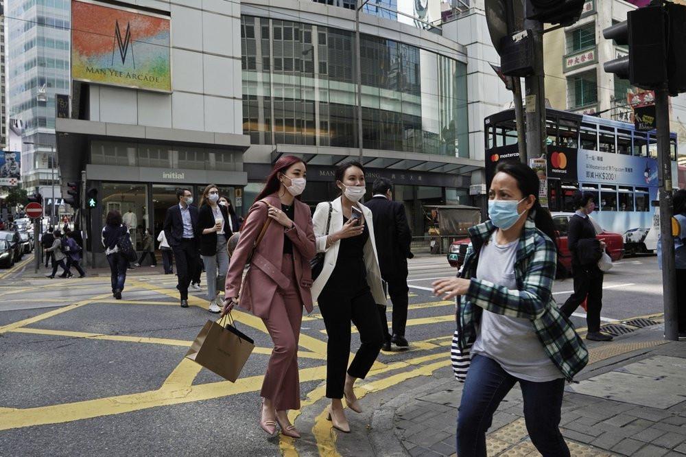 Fear of coronavirus pandemic grows but China eases curbs as new infections fall