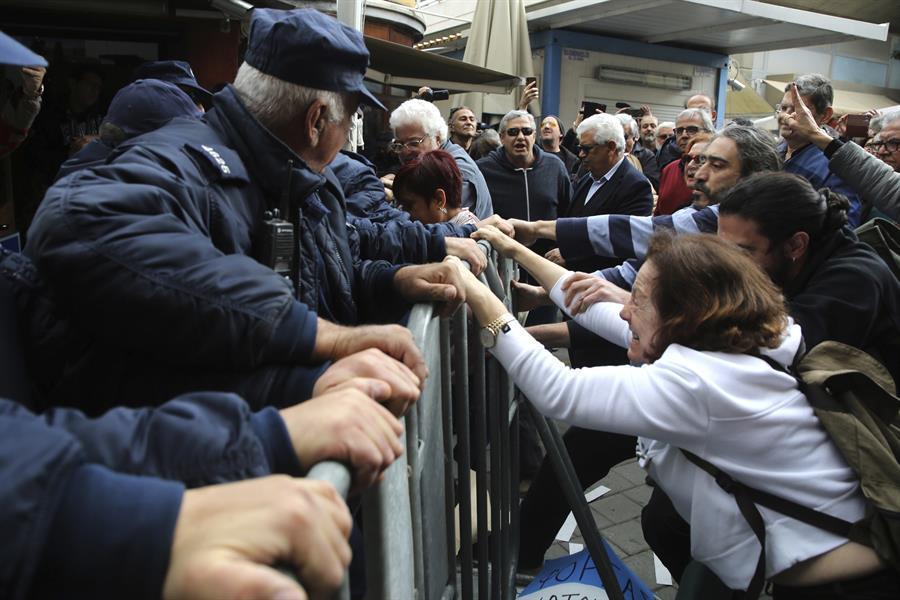 Turkish, Greek Cypriots push aside barriers in divided Nicosia