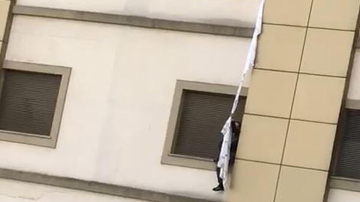 Patient being tested for virus tries to escape from hospital using bedsheets