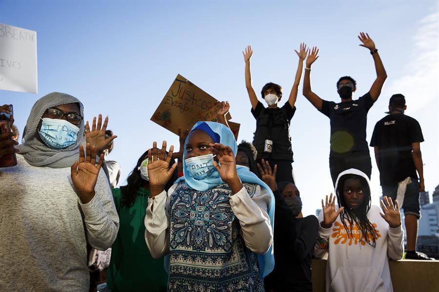 Officer charged with murder of black American as protests sweep US