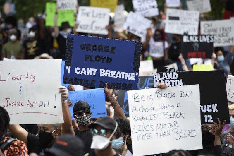 Protests over police killings rage in dozens of US cities