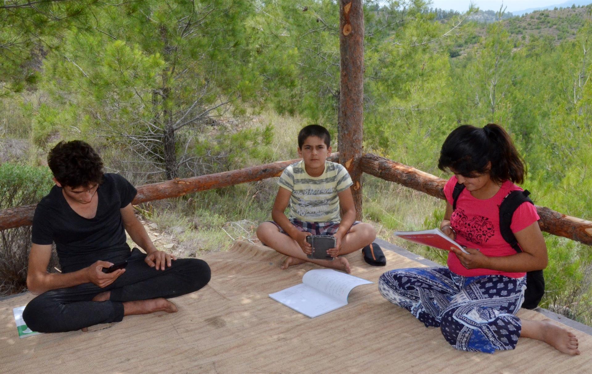 Children trek 4 km in Taurus Mountains every day to pick up signal for online classes