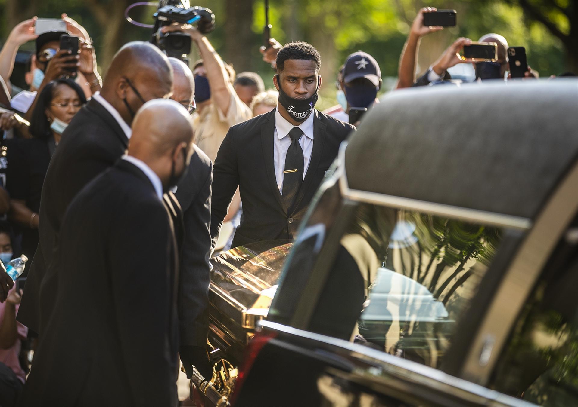 Thousands mourn George Floyd as accused officer appears in court