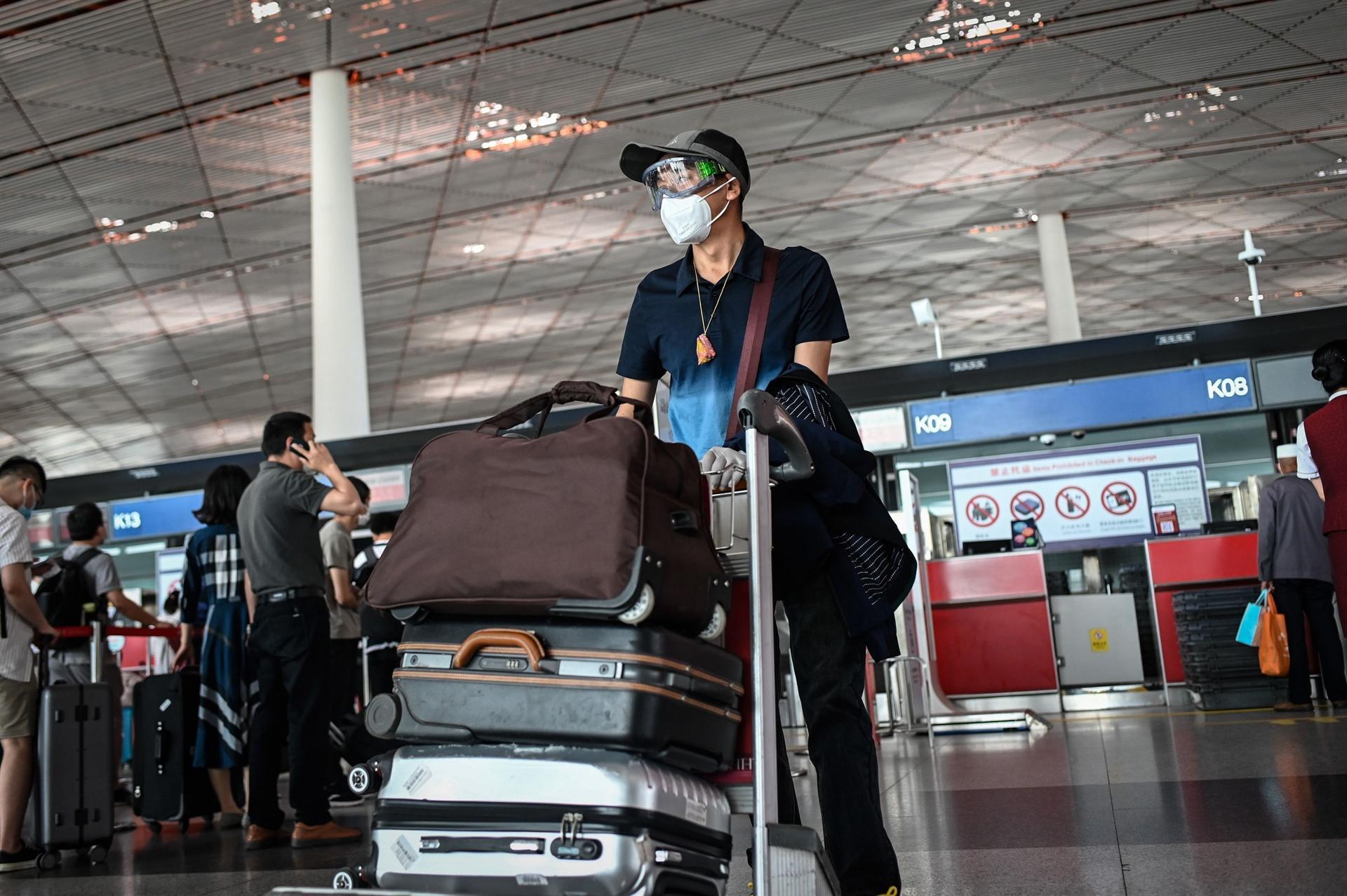 Beijing cuts flights to curb potential spread of mounting coronavirus cases