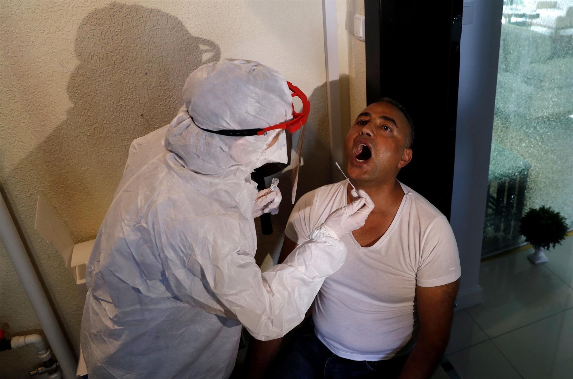 Teams go door-to-door to check on people in isolation