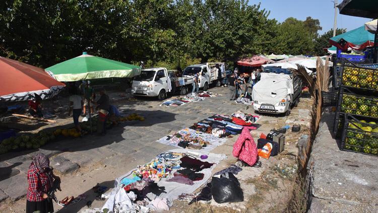 Historic Silk Road damaged by marketplace, vehicles