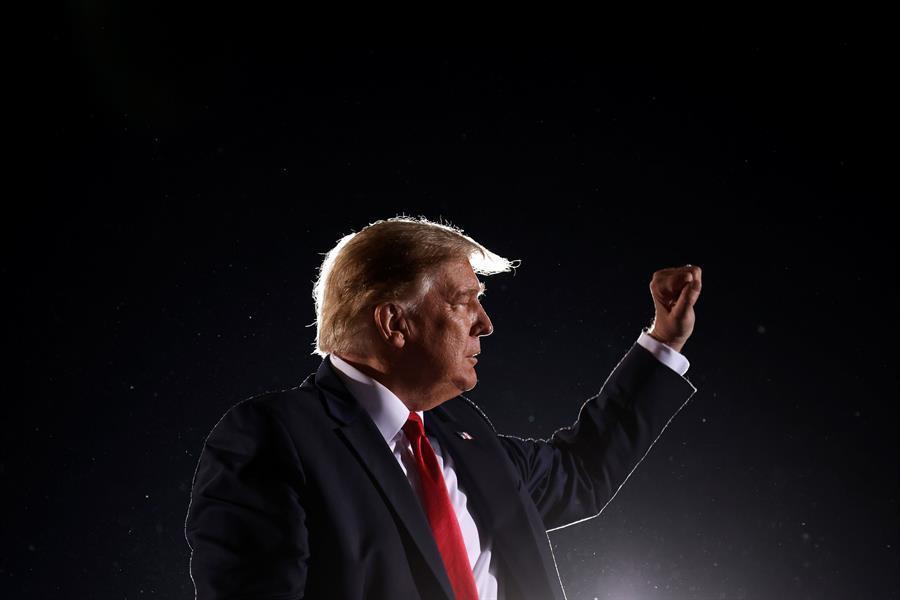 Trump on defense, courting voters in two must-win states