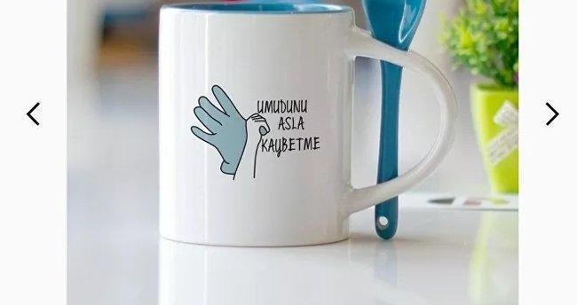Mugs depicting quake victim put up for sale anger public