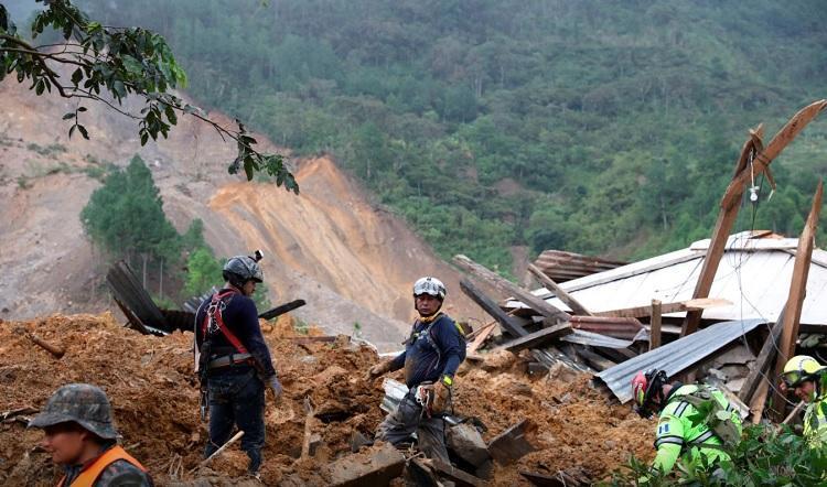 Fresh landslides halt search in Guatemalan hamlet buried in mud