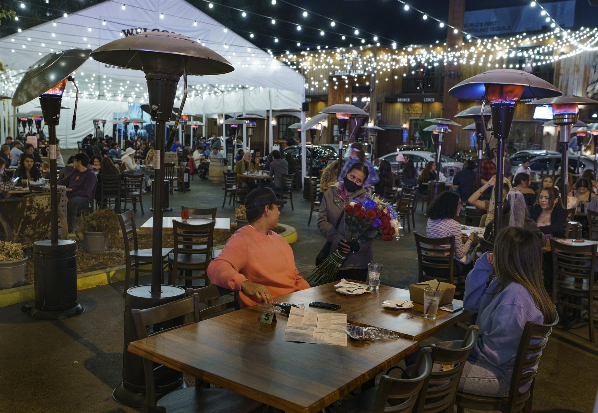 LA shuts restaurants as virus surges, but Europe lockdowns to ease