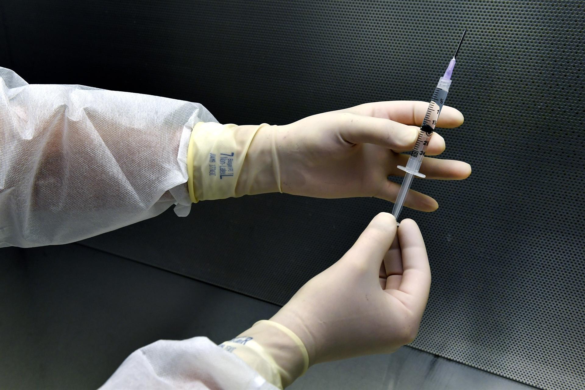 Britain starts virus jabs as Biden vows 100 mln vaccinations