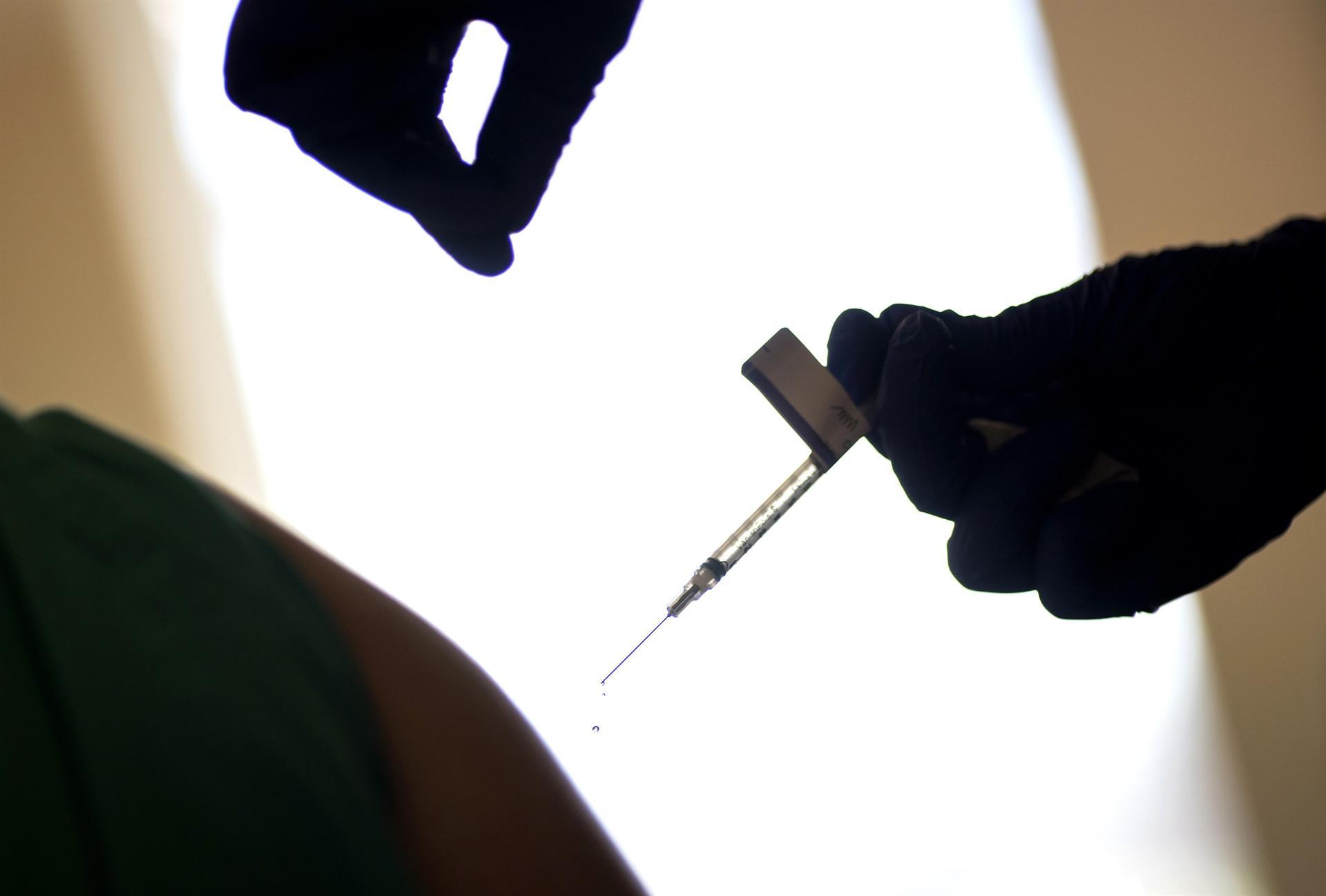 UK isolated over new virus strain as EU approves vaccine