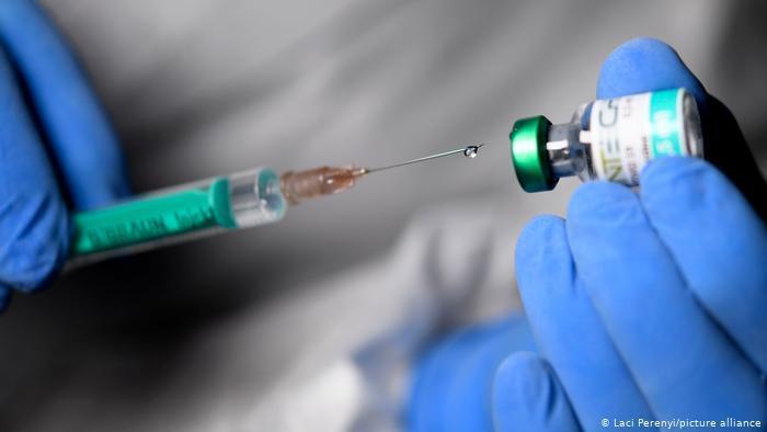 EU begins vaccine rollout as new virus strain spreads