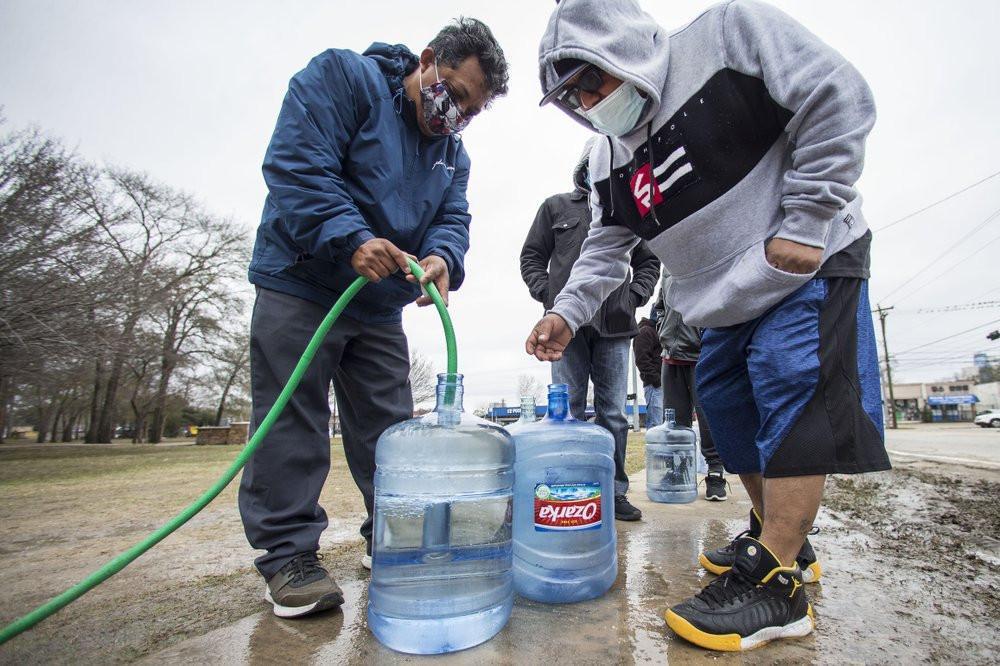 Lights come back on in Texas as water woes rise in the South