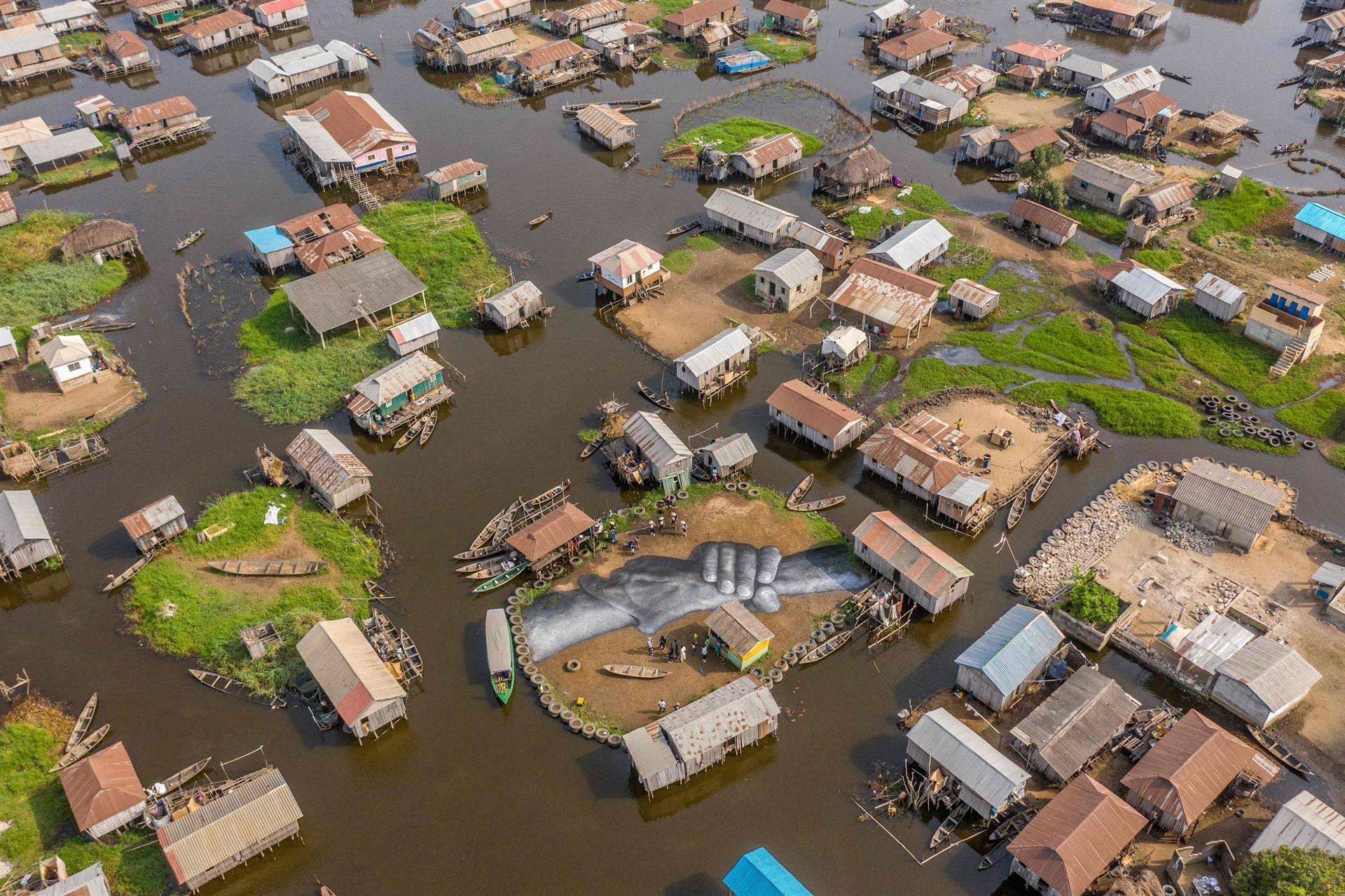 Giant fresco appears in floating Benin village