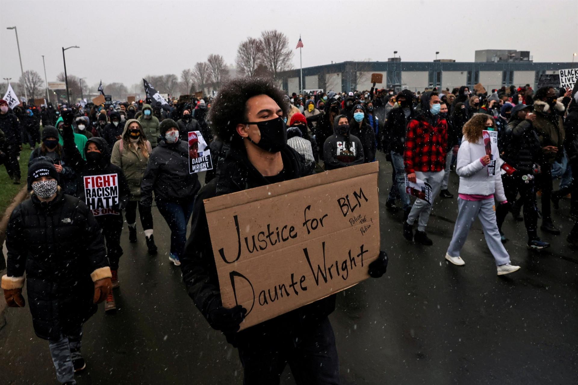 Minnesota shooting charging decision awaited, protests go on