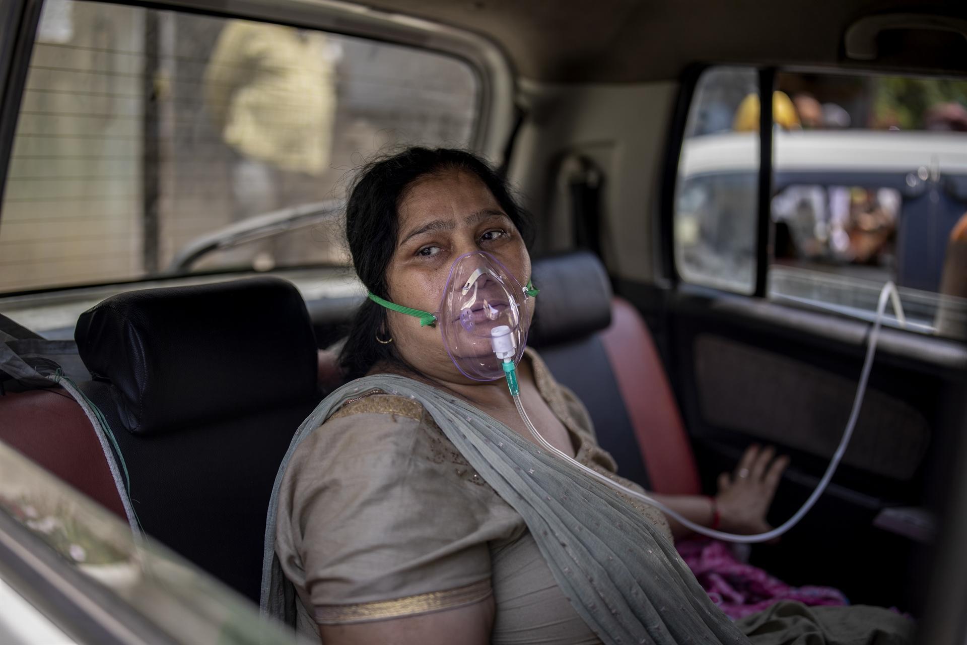 India COVID death toll passes 200,000, Biden hails stunning US progress