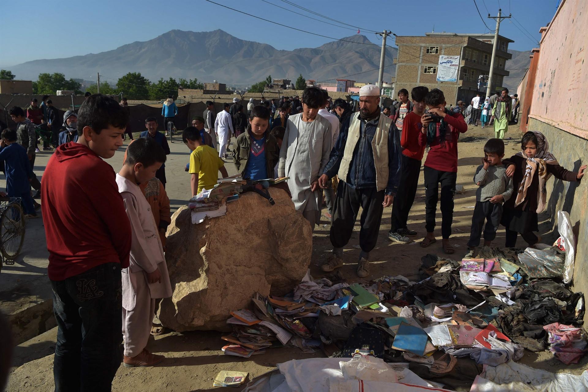 Afghans begin burying dead from bloody school blasts