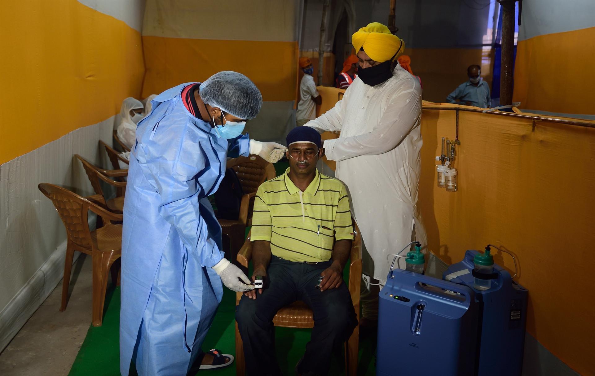 Britain set to ease virus lockdown, but huge India outbreak persists