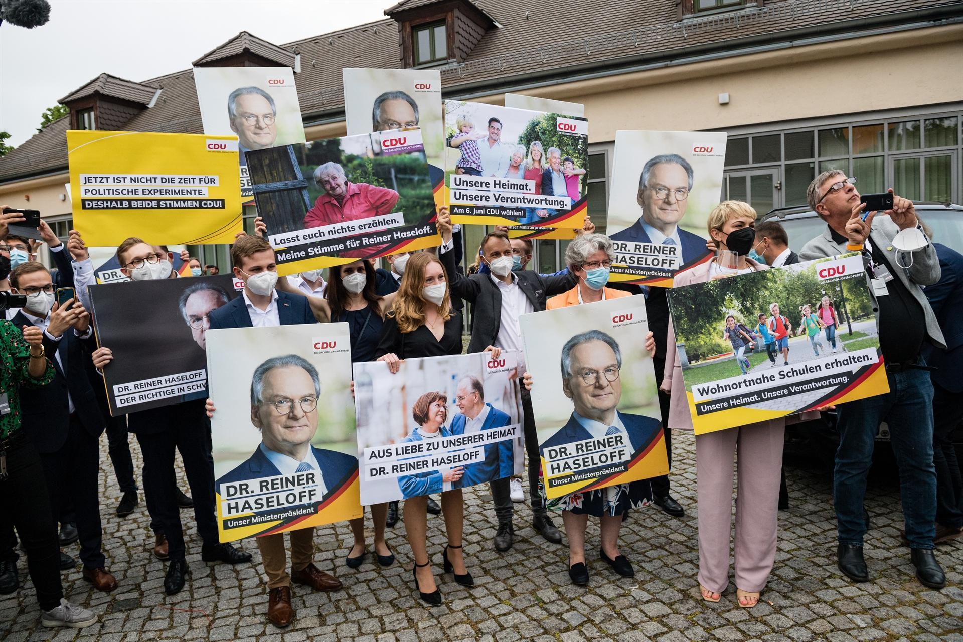 Momentum with Merkel party after victory in key state poll