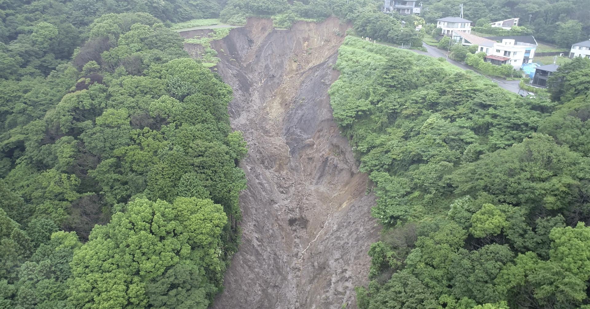Japan searches for dozens missing in resort town mudslide