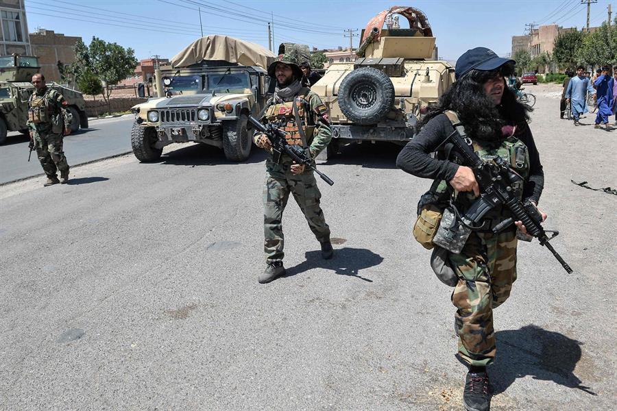 Taliban warn of more targeted attacks as Afghan forces defend besieged cities