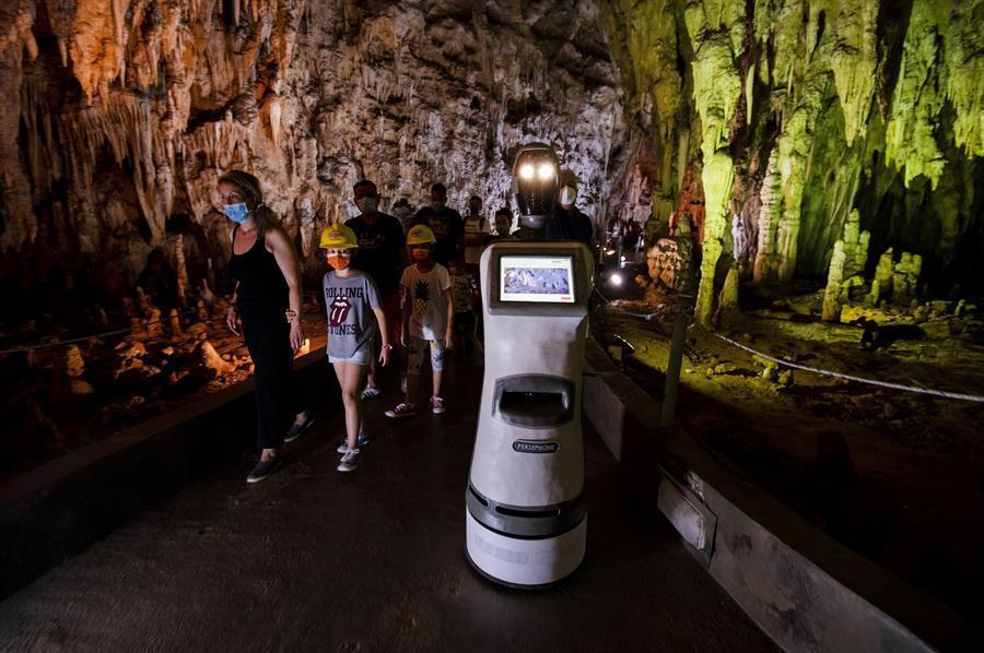 Robot guide leads visitors in a Greek cave