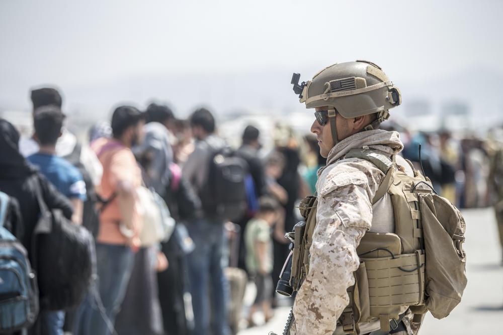 US troops surge evacuations out of Kabul but threats persist